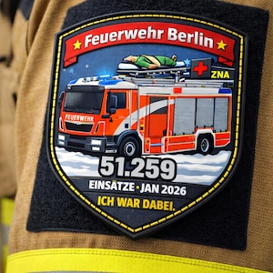 Könnte beinhalten: Ein Abzeichen mit den Worten "Feuerwehr Berlin" und einem Feuerwehrauto. Das Abzeichen enthält auch den Text "51.259 Einsätze - Jan 2026" und "Ich war dabei."