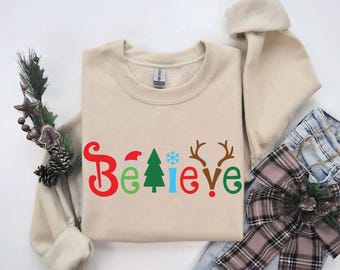 T-shirt « Crois en Noël », motif festif avec le Père Noël, un sapin et des bois de renne, sweat-shirt cadeau de Noël