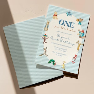 Puede incluir: Una tarjeta de invitación azul claro con un sobre a juego. La invitación presenta el texto "ONE for the books" y "Bryson's First Birthday". La tarjeta está decorada con ilustraciones de personajes de cuentos.