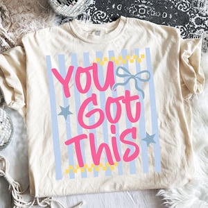 May include: A set of three ceramic mugs with a speckled, matte finish. The mugs are in shades of cream, light gray, and dark gray. Each mug has a simple, minimalist design and a rounded handle. Perfect for coffee or tea.