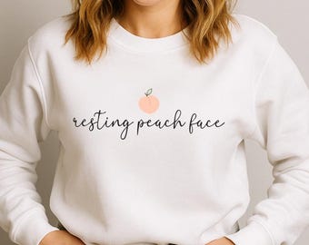 Sudadera con capucha o de cuello redondo con estampado divertido de cara de melocotón en reposo