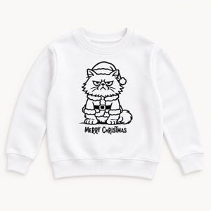 May include: A white long-sleeve sweatshirt featuring a black line art graphic of a grumpy cat wearing a Santa hat and a Santa suit. Below the cat illustration, the text Merry Christmas is printed in a bold, black, sans-serif font.