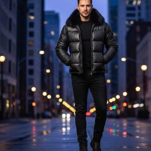 May include: A black puffer jacket with a faux fur collar. The jacket is worn over a black shirt and paired with black jeans and boots. The person is standing on a wet street with city lights in the background.