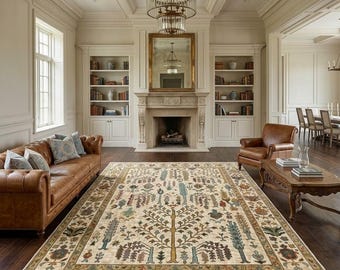 Alfombra Oushak anudada a mano, estilo vintage, de inspiración turca, con estampado floral, en tonos suaves neutros beige y azul apagado.