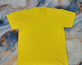 Camiseta vintage Chanel Boutique Paris con logo grande bordado, años 90 - Talla M