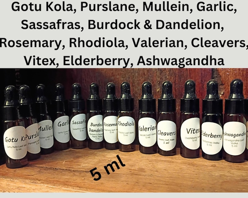 May include: A collection of small, brown glass dropper bottles with black caps, each labeled with a different herbal name. The labels include names like Gotu Kola, Valerian, and Elderberry. The text "5 ml" is also visible.