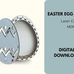 May include: A light gray laser-cut Easter egg box with a decorative zigzag and circle pattern. The box is open, revealing a white interior. Text on the right reads "EASTER EGG BOX" and "DIGITAL DOWNLOAD".