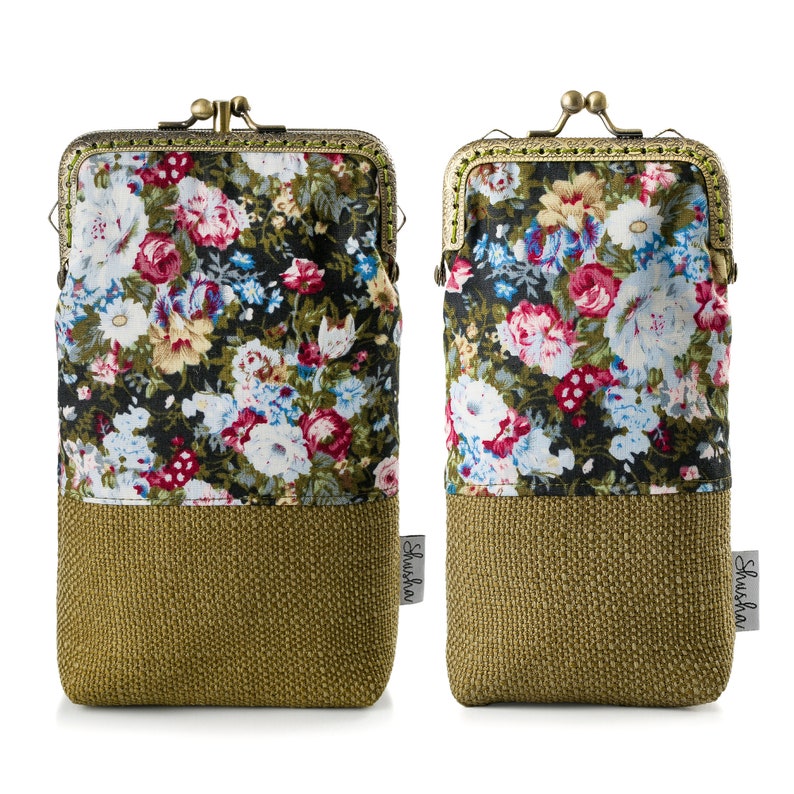 May include: Two green floral print fabric coin purses with a gold metal clasp and a brown woven fabric bottom. The purses have the word "Shushou" printed on the side.