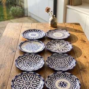 May include: A rustic wooden sign with the text "Welcome to our home" in white lettering. The sign has a distressed finish and a simple, inviting design, ideal for entryway decor.