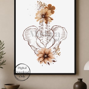 May include: A framed wall art print featuring a brown line drawing of a human pelvis and sacrum. The anatomical illustration is decorated with clusters of brown and tan flowers at the top and bottom. The text Digital Download Only is visible.