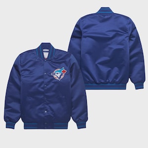 May include: A blue satin baseball jacket featuring a team logo patch on the chest. The jacket has a ribbed collar, cuffs, and hem with blue and white stripes. The jacket is displayed on a white background.