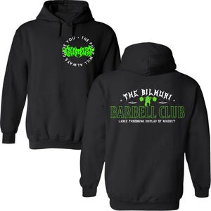 Puede incluir: Sudadera con capucha negra con texto verde y blanco. La parte delantera presenta un diseño circular con las palabras "GUIDE YOU. THE PUMP WILL ALWAYS." La parte trasera muestra "THE BILMURI BARBELL CLUB" con un gráfico de levantador de pesas.