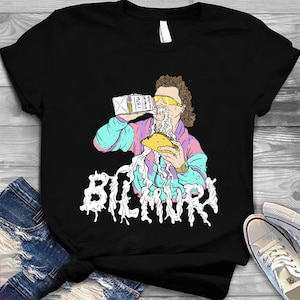 Könnte beinhalten: Schwarzes T-Shirt mit einer farbenfrohen Illustration einer Person mit Sonnenbrille und Jacke, die Milch über einen Taco gießt. Das Wort "BILMURY" ist in einer tropfenden Schrift darunter geschrieben.