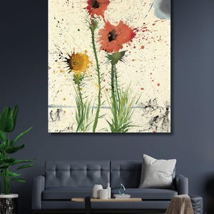May include: A rectangular wall art print featuring a painting of three spiky, thistle-like flowers with red and yellow petals. The artwork displays a cream-colored background with red paint splatters, green stems, and a dark cloud in the upper right corner.