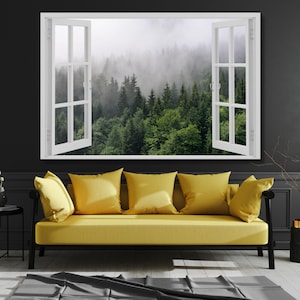 May include: A yellow sofa with four matching cushions sits below a large rectangular wall art piece featuring an open white window frame looking out onto a dense forest landscape filled with green pine trees and thick grey morning fog.