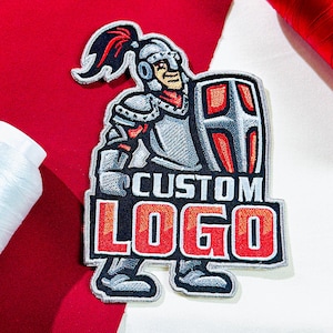 May include: Embroidered patch featuring a knight in silver armor holding a shield. The patch has the words "CUSTOM LOGO" in red and white on a black background. The knight has a red plume and is set against a red and white fabric.