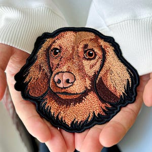 May include: A set of three ceramic mugs with a speckled, matte finish. The mugs are in shades of cream, light gray, and dark gray. Each mug has a simple, minimalist design and a rounded handle.