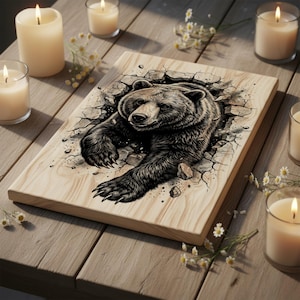 May include: A rectangular wooden plaque featuring a detailed illustration of a bear breaking through a cracked surface. The bear is depicted in shades of brown and black, with its claws extended. The plaque is surrounded by lit candles and small white flowers.