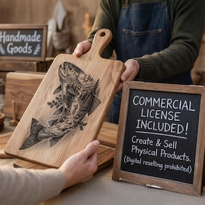May include: A light brown wooden cutting board with a handle, featuring a detailed black laser-engraved illustration of a fish jumping out of a river with a forest and mountain background. A chalkboard sign nearby reads Commercial License Included.