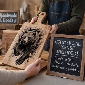 May include: Wooden cutting board with a handle, featuring a detailed illustration of a bear breaking through a wall. The board is light brown with a dark brown bear design. A small chalkboard sign reads "COMMERCIAL LICENSE INCLUDED!"