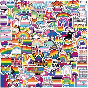 May include: A collection of colorful Pride stickers featuring rainbows, flags, hearts, and various cartoon characters. The stickers display phrases like "Pride," "Be Proud," and "You are safe here."