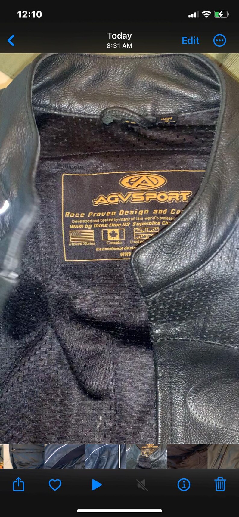 May include: Black leather motorcycle jacket with a perforated inner lining. The jacket features a label with the text "AGVSPORT Race Proven Design and Co." and flags of the United States, Canada, and the United Kingdom.