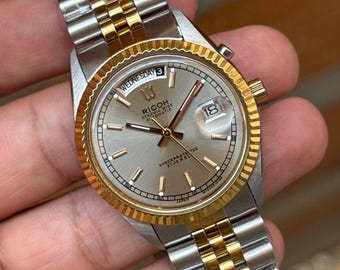 Ricoh president automatic day/date men’s wrist watch