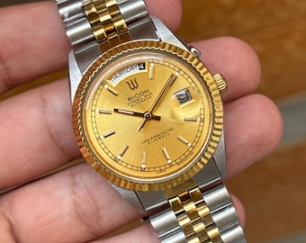 Ricoh president automatic day/date men’s wrist watch