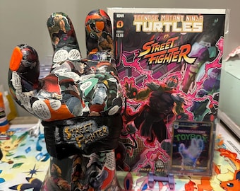 Soporte para dispositivo de cómic crossover de TMNT y Street Fighter