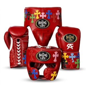 May include: A set of red boxing equipment including two lace-up gloves, a groin protector, and a headgear piece. Each item features multi-colored cross appliques and a black oval patch with the white text NO BOXING NO LIFE printed on them.