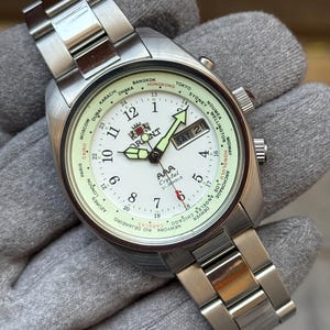 Reloj de pulsera automático para hombre Orient Crystal de 21 joyas con hora mundial, día y fecha.