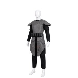 May include: A gray textured armor vest with shoulder pauldrons and a matching utility belt featuring multiple pouches, worn over a black long-sleeved shirt and black trousers on a white mannequin. The armor has a weathered, matte finish.