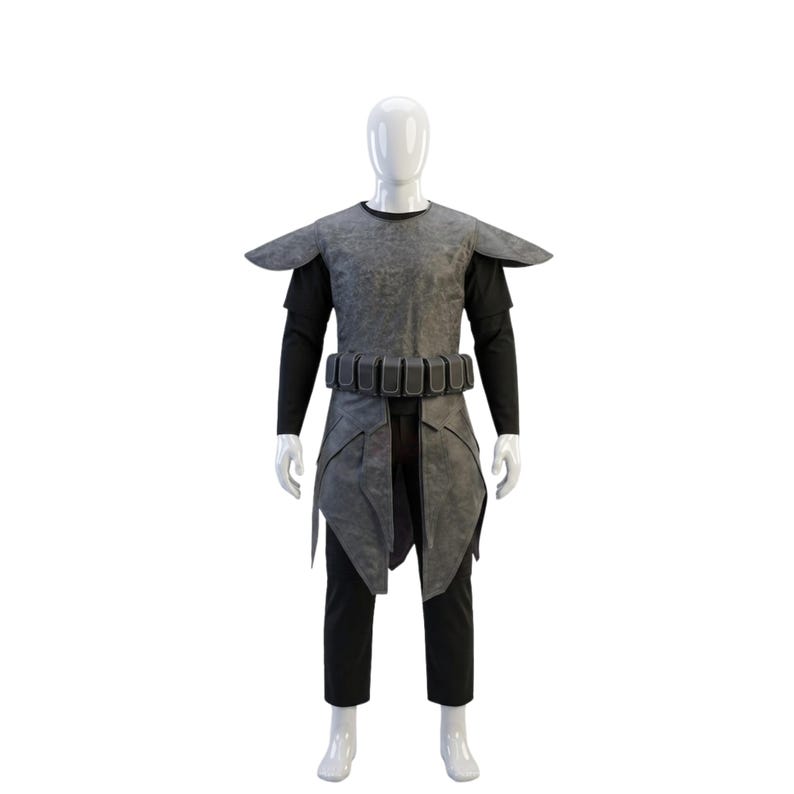 May include: A gray textured tunic with shoulder pauldrons and a utility belt featuring multiple pouches, worn over a black long-sleeved shirt and black trousers on a white mannequin. The ensemble includes a layered skirt section with pointed panels.
