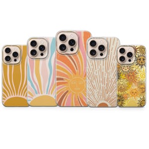 May include: A collection of five phone cases with various sun designs. The cases feature a range of colors, including yellow, orange, pink, and cream. Each case has a unique sun-themed graphic, with some showcasing radiating lines and others featuring sun faces.