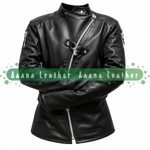 May include: A black leather jacket featuring an asymmetrical silver zipper closure, a high collar with a snap button, and additional silver zippers on the sleeves. A decorative metal buckle strap is positioned across the chest. The text Aaana Leather Aaana Leather is visible across the center.