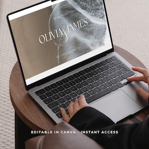 May include: A silver laptop displaying a wedding website template with the text "OLIVIA & JAMES". The laptop is on a dark wooden table, with the text "EDITABLE IN CANVA - INSTANT ACCESS" at the bottom of the screen.