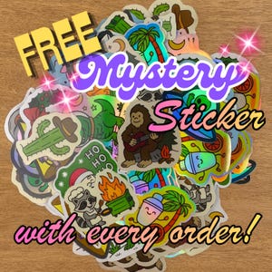 May include: A collection of colorful stickers with various designs, including a cactus, palm trees, and a Bigfoot playing guitar. The image includes text that says "FREE Mystery Sticker with every order!"