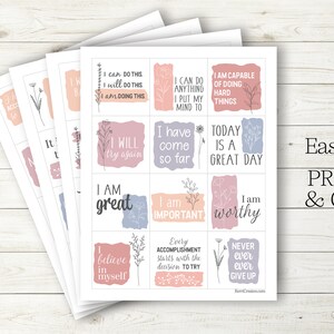 May include: Printable affirmation cards with positive messages like "I am great" and "I will try again". The cards have a light pink, blue, and gray color scheme with floral illustrations.