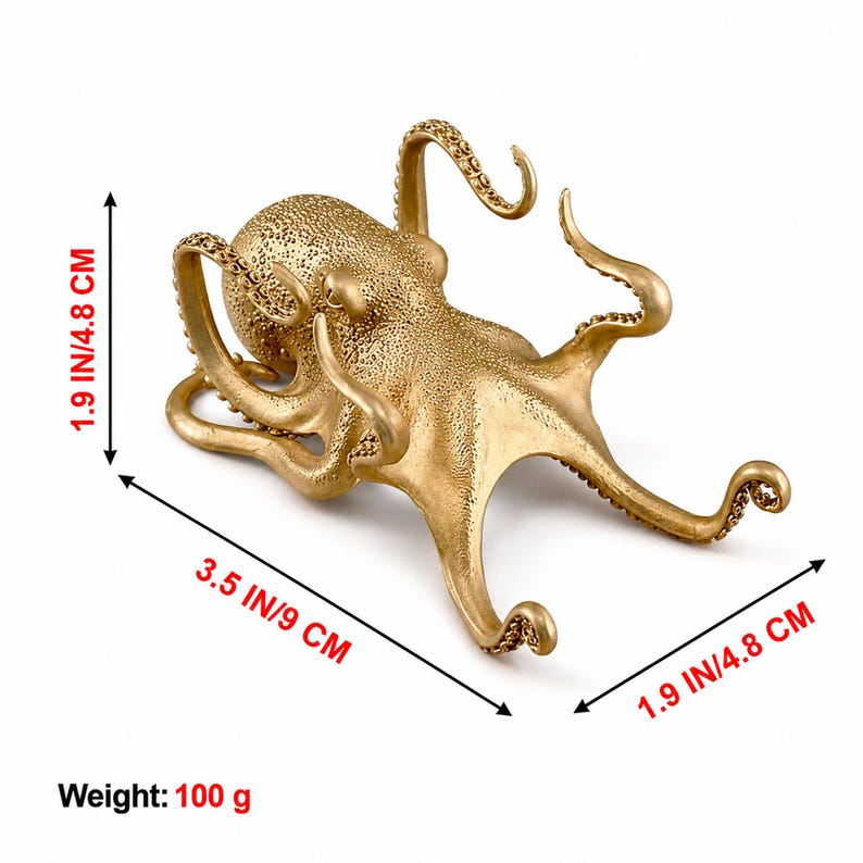 May include: A gold-colored octopus figurine with a textured surface and eight curved tentacles. The object measures 1.9 inches in height, 3.5 inches in length, and 1.9 inches in width, with a total weight of 100 grams as indicated in the image.