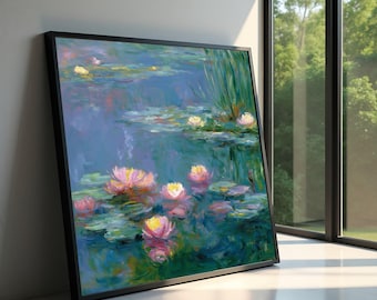 May include: A framed painting of water lilies in a pond. The artwork features pink and yellow flowers with green lily pads floating on a blue-green water surface. The painting is in a black frame and leans against a white wall.