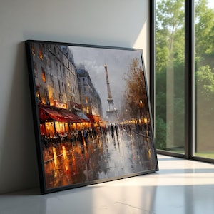 Op de afbeelding: Een ingelijst olieverfschilderij toont een regenachtige Parijse straatscène. De Eiffeltoren is zichtbaar in de verte. Gebouwen met rode luifels en warme verlichting staan langs de straat. Het kunstwerk zit in een zwart frame.