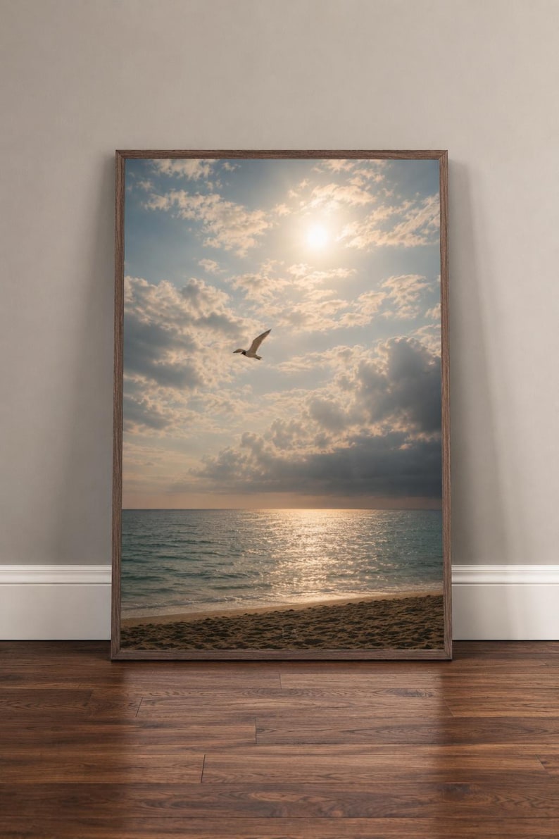 Seabird flying over the sunlit water at Saint Andrews State Park, photographed by EA Studio