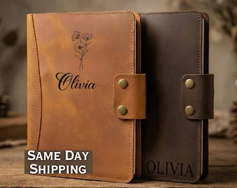 May include: Two leather journals, one tan and one brown, with a snap closure. The tan journal has a floral design and the name "Olivia" engraved. The brown journal also has "Olivia" engraved. The text "SAME DAY SHIPPING" is visible on the tan journal.
