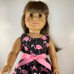Flamingos on black fabric with pink belt to match, made to fit 18 inch dolls such as American Girl Dolls or similar size dolls