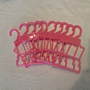 Plastic pink double hangers to fit 14.5 inch doll clothes such as Wellie Wissher and similar size dolls