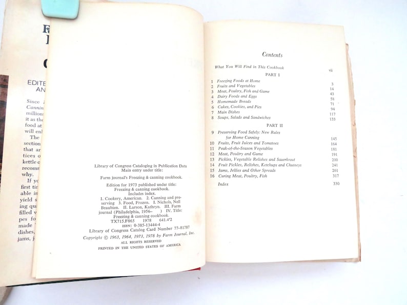 May include: An open cookbook titled Farm Journal's Freezing & Canning Cookbook. The left page displays Library of Congress cataloging data and copyright information. The right page shows the table of contents listing sixteen chapters.