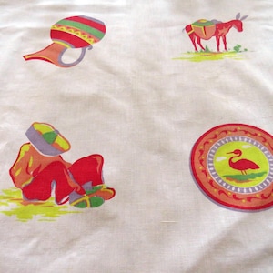 May include: White fabric with colorful Mexican-themed illustrations. The design includes a red donkey, a person in a sombrero, a red and green jar, and a decorative plate with a bird.