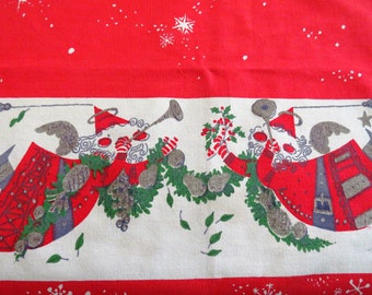 May include: Red and white Christmas-themed fabric with a repeating pattern of Santa-like figures playing instruments and holding holly. The figures are in red coats with gray hair and beards, surrounded by green wreaths and snowflakes.