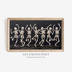 May include: A rectangular framed artwork featuring seven off-white skeletons in various dancing poses against a solid black background. The skeletons are arranged in a horizontal line, each displaying different arm and leg positions. The frame is light wood.