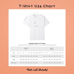 May include: White t-shirt size chart with imperial and metric measurements. The chart includes width, length, and sleeve length for sizes XS to 5XL. The text "T-Shirt Size Chart" is at the top, and "her cat draws!" is at the bottom.